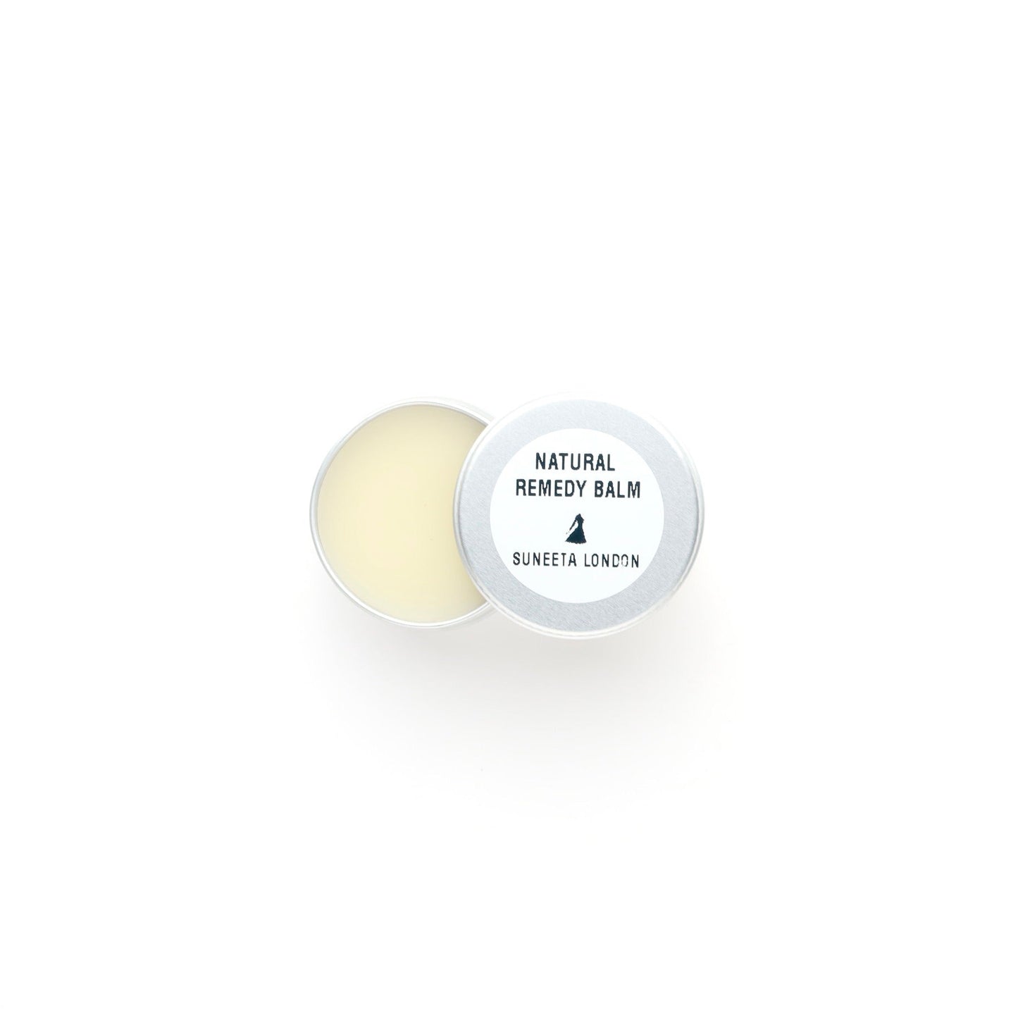 Round natural remedy balm with a white container on a white background