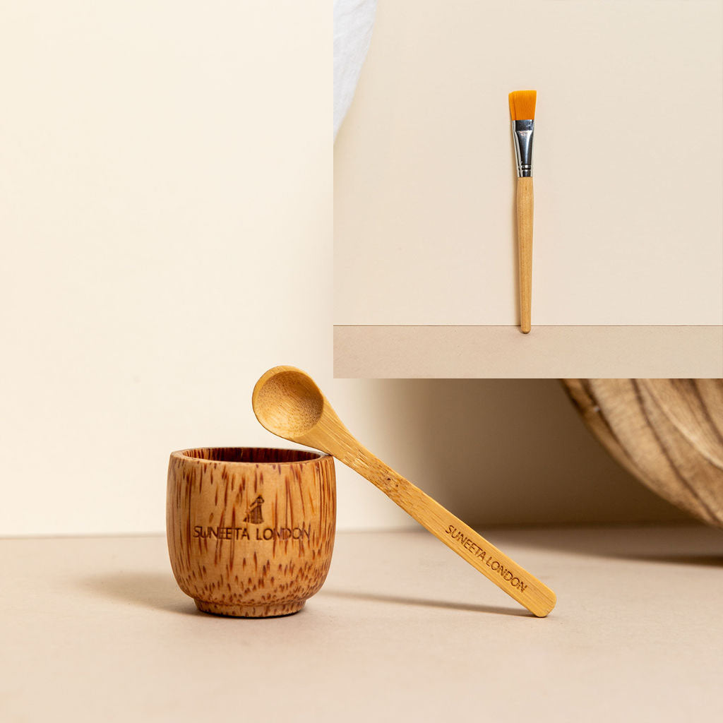 bamboo bowl with spoon and brush to mix and apply suneeta Londons natural and handmade face masks